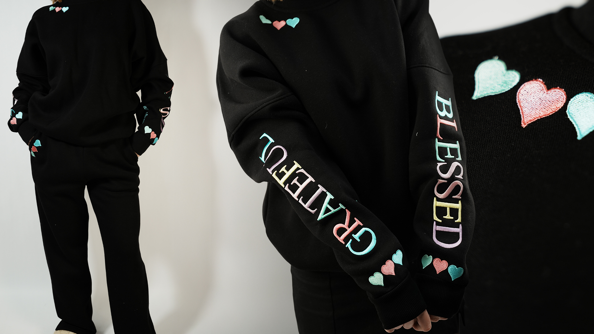 Black sweatshirt and pants set with pastel heart and word embroidery